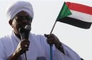 Sudan's President Bashir addresses the crowd after arriving at Khartoum Airport