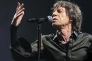 Mick Jagger of The Rolling Stones performs at Glastonbury, England on Saturday, June 29, 2013. Thousands are to enjoy the three day festival that started on Friday, June 28, 2013 with headliners Arctic Monkeys, the Rolling Stones and Mumford and Sons. (Photo by Jim Ross/Invision/AP)