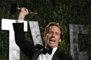 Nat Faxon holds his award for Best Adapted Screenplay for "The Descendants" at the 2012 Vanity Fair Oscar party in West Hollywood