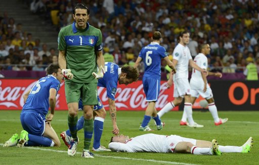 Italy's goalkeeper Buffon reacts next to teammates Barzagli and Diamanti and England's Rooney during their Euro 2012 quarter-final soccer match at Olympic Stadium in Kiev