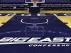 FILE - In this Dec. 15, 2012, file photo, a Big East Conference logo is displayed on the court after Georgetown played Western Carolina in an NCAA college basketball game at the Verizon Center in Washington.  Big East football schools will get almost all of a $110 million pot in a deal that will allow seven departing basketball schools to keep the name Big East and start playing in their own conference next season, a person familiar with the negotiations says. The basketball schools, which include Georgetown, St. John's, Villanova, Seton Hall, Providence, Marquette and DePaul, will receive $10 million, keep the conference name and the right to play their conference tournament at Madison Square Garden. (AP Photo/Jacquelyn Martin, File)