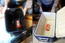 This combination of pictures shows the flight recorder (L) from the EgyptAir plane, that crashed into the Mediterranean, after it was recovered from the bottom of the Mediterranean by search teams