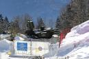 An anti-aircraft missile base sits outside the cross-country skiing venue prior to the 2014 Winter Olympics, Thursday, Feb. 6, 2014, in Krasnaya Polyana, Russia. (AP Photo)