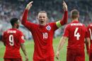 England's Wayne Rooney celebrates his goal during the Euro 2016 Group E qualifying soccer match between Slovenia and England, in Ljubljana, Slovenia, Sunday, June 14, 2015. (AP Photo/Darko Bandic)