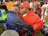 Denver Broncos head coach John Fox, left, greets Kansas City Chiefs coach Romeo Crennel at the end of an NFL football game, Sunday, Dec. 30, 2012, in Denver. Denver won 38-3. (AP Photo/Jack Dempsey)