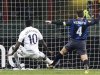 Tottenham Hotspur's Emmanuel Adebayor shoots to score past Inter Milan's Javier Zanetti during their Europa League soccer match in Milan