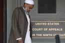 FILE - This May 11, 2012 file photo, Portland Imam Mohamed Sheikh Abdirahman Kariye, who is one of 15 men who say their rights were violated because they are on the U.S. government's no-fly list, leaves the United Sates Court of Appeals following oral arguments on the ACLU No Fly List challenge, in Portland, Ore. A federal judge has ruled Tuesday, June 24, 2014, that the U.S. government violated the rights of 13 people on its no-fly list by depriving them of their constitutional right to travel, and gave them no adequate way to challenge their placement on the list. (AP Photo/Rick Bowmer, File)