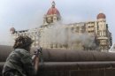 An Indian soldier aims his rifle towards the Taj Mahal hotel during the 2008 Mumbai attacks