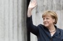 German Chancellor Merkel waves to spectators during the arrival for the "Council of the Baltic Sea States" summit in Stralsund