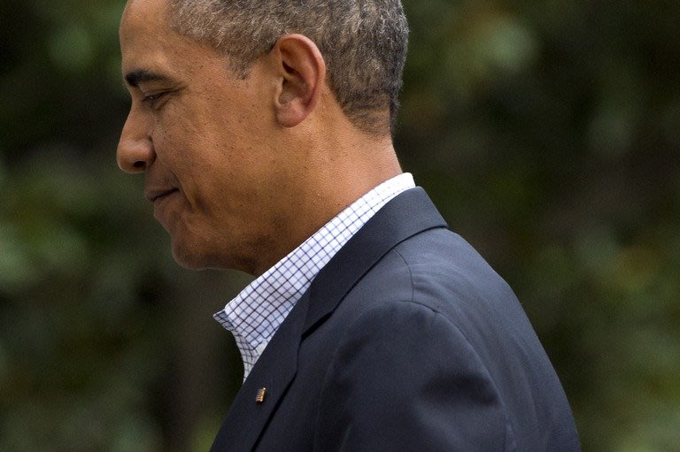 US President Barack Obama arrives at the White House in Washington on August 23, 2013