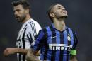 Inter Milan's Mauro Icardi reacts as Juventus' Andrea Barzagli stands in background, during their Serie A soccer match at the San Siro stadium in Milan, Italy, Sunday, Oct. 18, 2015. (AP Photo/Luca Bruno)