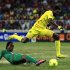 Togo's Adebayor is tackled by Burkina Faso's Kone during their African Cup of Nations quarter-final soccer match at the Mbombela Stadium in Nelspruit