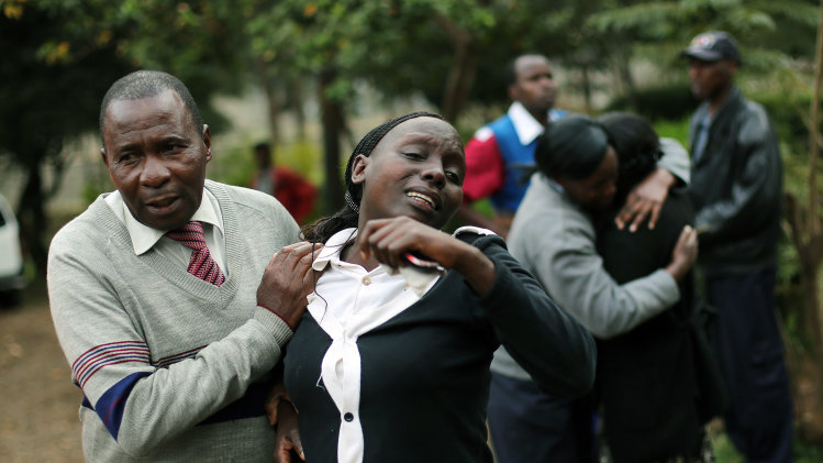 Relatives of Johnny Mutinda Musango, 48, weep after identifying his body at the city morgue in Nairobi, Kenya Tuesday Sept. 24 2013. Musango was one of the victims of the Westgate Mall hostage siege. Kenyan security forces were still combing the Mall on the fourth day of the siege by al-Qaida-linked terrorists. (AP Photo/ Jerome Delay)