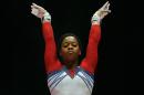 FILe - In this Oct. 31, 2015, file photo, Gabby Douglas of the U.S. performs on the uneven bars during the women's apparatus final competition at the World Artistic Gymnastics championships at the SSE Hydro Arena in Glasgow, Scotland. The 2012 Olympic all-around champion returns to the event that kickstarted her run to gold this weekend in the American Cup, but the stakes are far different this time around. (AP Photo/Matthias Schrader, File)