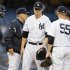 Yankees' Hughes heads to the dugout during the first inning of their MLB American League baseball game against Mariners in New York