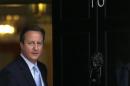 Britain's Prime Minister David Cameron prepares to greet President Nicos Anastasiades of Cyprus at Number 10 Downing Street in London