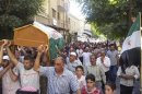 Residents carry the coffin of Mousa during his funeral in Yabroud