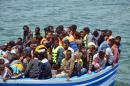 Migrants arrive at the port in the Tunisian town of Ben Guerdane following their rescue by Tunisia's coastguard and navy on June 10, 2015