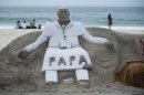 A sand sculpture that resembles Pope Francis sits on Copacabana beach, Rio de Janeiro, Brazil on Sunday, July 21, 2013. Pope Francis, the 76-year-old Argentine who became the church's first pontiff from the Americas in March, will return Monday to the embrace of Latin America to preside over the Roman Catholic Church's World Youth Day festival.(AP Photo/Victor R. Caivano)