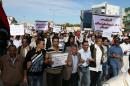Libyan protesters gather during a demonstration calling on militiamen to vacate their headquarters in southern Tripoli on November 15, 2013