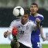 Germany's Mueller is challenged by Tibi of Israel during their friendly soccer match in Leipzig