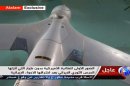 In this image taken from the Iranian state TV's Arabic-language channel Al-Alam, showed what they purport to be an intact ScanEagle drone aircraft put on display, as an exclusive broadcast Tuesday Dec. 4, 2012, showing what they say are the first pictures of a captured drone. Iran authorities claimed Tuesday it had captured a U.S. drone after it entered Iranian airspace over the Persian Gulf, and showing an image of a purportedly downed craft on state TV, but the U.S. Navy said all its unmanned aircraft in the region were "fully accounted for."(AP Photo / Al-Alam TV) TV OUT