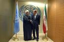 UN Secretary-General Ban Ki-moon, right, greets Iranian President Hassan Rouhani before a meeting at the United Nations Tuesday, Sept 23, 2014, on the sidelines of the 69th Session of the UN General Assembly. (AP Photo/Jewel Samad, Pool)