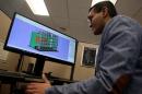 Product Development Engineer Jigar Patel works with a CAD image of a thrust reverser cascade in development at Oxford Performance Materials Inc., in South Windsor, Connecticut
