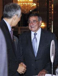 U.S. Defense Secretary Leon Panetta, right, speaks to Singapore's Prime Minister Lee Hsien Loong, left, at the opening session of the IISS Shangri-la
 Security Summit in Singapore on Friday June 1, 2012. (AP Photo/Wong Maye-E)