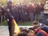 In this image made from video, a police officer uses pepper spray as he walks down a line of Occupy demonstrators sitting on the ground at the University of California, Davis on Friday, Nov. 18, 2011. The video - posted on YouTube - was shot Friday as police moved in on more than a dozen tents erected on campus and arrested 10 people, nine of them students. (AP Photo/Thomas K. Fowler)