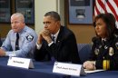 Obama takes part in a round table discussion on ways to reduce gun violence during a visit to the Minneapolis Police Department Special Operations Center in Minneapolis