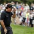 Phil Mickelson tips his hat on the 12th green during the first round of the U.S. Open golf tournament at Merion Golf Club, Thursday, June 13, 2013, in Ardmore, Pa. (AP Photo/Charlie Riedel)