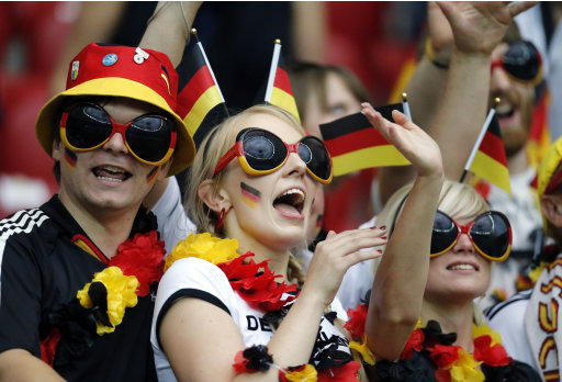 German fans cheer before the Euro 2012 soccer championship semifinal match between Germany and Italy in Warsaw, Poland, Thursday, June 28, 2012. (AP Photo/Matthias Schrader)