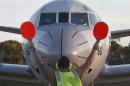 Japan Maritime Self-Defense Force's P-3C Orion arrives to help with search operations for the missing Malaysia Airlines Flight MH370 at Royal Australian Air Force Pearce Base in Perth, Australia, Sunday, March 23, 2014. (AP Photo/Jason Reed, Pool)