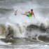 A surfer kicks out at the top of a wave after a ride, Saturday Oct. 27, 2012 in Jacksonville, Fla. Hurricane Sandy, upgraded again Saturday just hours after forecasters said it had weakened to a tropical storm, was barreling north from the Caribbean and was expected to make landfall early Tuesday near the Delaware coast, then hit two winter weather systems as it moves inland, creating a hybrid monster storm.   (AP Photo/The Florida Times-Union, Bob Mack)