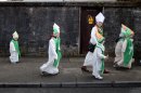 Children dressed as St Patrick make their way to the St Patrick's Day parade in Limerick, Ireland, Sunday, March 17, 2013. (AP Photo/Peter Morrison)