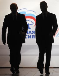 Russian President Dmitry Medvedev, right, and Prime Minister Vladimir Putin, left, seen as arrive at the United Russia party congress in Moscow on Sunday, Nov. 27, 2011. Prime Minister Vladimir Putin has received a formal nomination from the ruling United Russia party to run for president in next March's election. Putin, who stepped down in 2008 after two presidential terms but has remained Russia's No. 1 leader, announced his intention to reclaim the top job in September. Sunday's nomination marks the official start of his election bid. (AP Photo/RIA-Novosti, Alexei Druzhinin, Presidential Press Service)