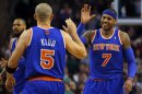 New York Knicks' Kidd and Anthony high five during their NBA basketball game against Boston Celtics in Boston