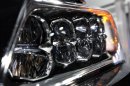 A headlight on the 2014 Acura RLX is shown at media previews for the North American International Auto Show in Detroit, Tuesday, Jan. 15, 2013. (AP Photo/Paul Sancya)