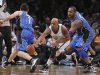 Brooklyn Nets forward Bogans cuts between Orlando Magic guard Redick and forward Davis to steal the ball in the fourth quarter of their NBA basketball game in New York
