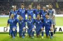 Italy's national soccer players line-up for a team photo before their World Cup Group B qualifying match against Denmark in Copenhagen