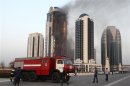 A multi-storey building, which is part of the Grozny-City complex, is seen on fire in the Chechen capital Grozny