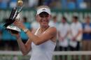 Caroline Wozniacki of Denmark holds up her trophy after her victory against Roberta Vinci of Italy in their tennis final match at the Istanbul Cup in Istanbul, Turkey, Sunday, July 20, 2014. Wozniacki overpowered second-seeded Vinci 6-1, 6-1 Sunday to win the Istanbul Cup final and clinch her first WTA title of the year.(AP Photo)