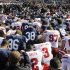 Penn State and Nebraska players gather at midfield for a pre-game prayer before an NCAA college football game in State College, Pa., Saturday, Nov. 12, 2011. (AP Photo/Gene J. Puskar)