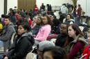 In this March 24, 2015 photo, University of Maryland students listen to speakers during a town hall meeting about racism in universities and what can be done to stop it, at University of Maryland in College Park, Md. Conversations like the one at Maryland's Nyumburu Cultural Center are taking place nationwide as racist incidents continue to pop up at colleges and universities, even though students are becoming increasingly vocal in protesting racism and administrators are taking swift, zero-tolerance action against it. (AP Photo/Jose Luis Magana)