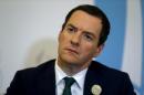British Finance Minister George Osborne listens to a question during an interview with Reuters in Ankara