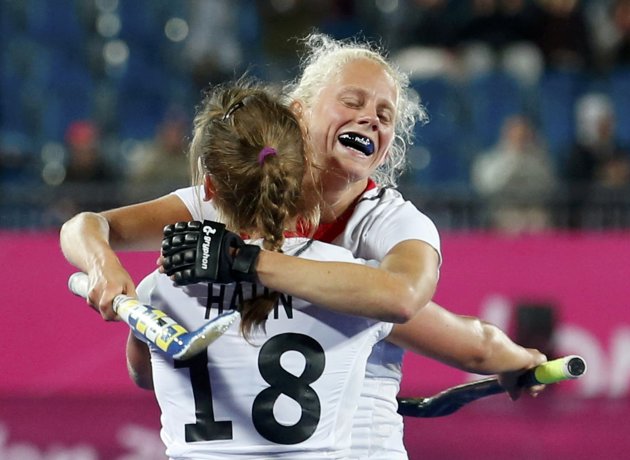 Germany's Lisa Hahn and her team mate Kristina Hillmann celebrate after winning their women's Group B hockey match against the U.S. at the London 2012 Olympic Games at the Riverbank Arena on the Olymp