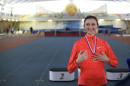 Russia's Maria Kuchina smiles with her gold medal after winning the women's high jump competition at a Russian Grand Prix track and field indoor event in Moscow, Russia, on Friday, Jan. 22, 2016. Just five months ago, Maria Kuchina won the world high jump title in front of tens of thousands of fans in Beijing. On Friday, she jumped at a meet with a few dozen athletes and fewer spectators. Russia's ban from global track and field over doping has forced some of the world's top athletes to compete at obscure domestic events with tiny crowds, rather than prestigious and lucrative international meets. (AP Photo/Ivan Sekretarev)