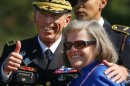 Gen. David Petraeus and his wife, Holly, smile during the general's retirement ceremony on Aug. 31, 2011.