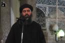 Image grab taken from a video released on July 5, 2014 by al-Furqan Media claims to show the leader of the Islamic State (IS) jihadist group, Abu Bakr al-Baghdadi, at a mosque in the northern Iraqi city of Mosul